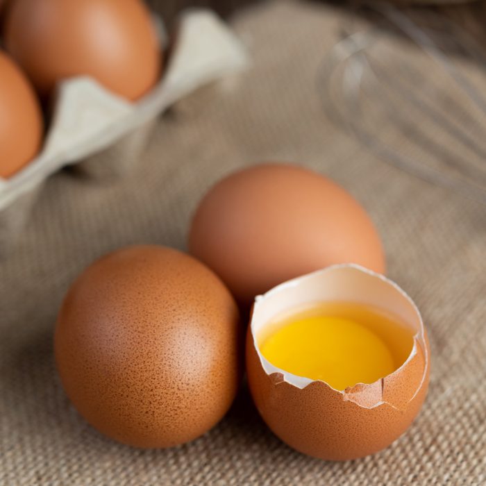 Eggs on the floor of hemp sacks. Selective focus.